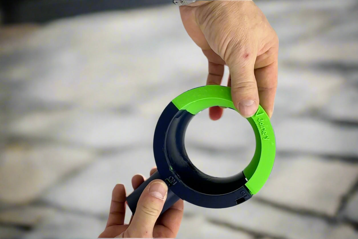 Hands-free dust collector with suction cup capturing drilling dust on wall